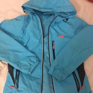 blue hooded windbreaker